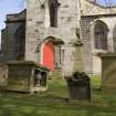 Table tomb with church in background, view from W