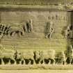 Carved panel at W end of table tomb, view showing farming scenes (flash)