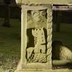 Detail of leg of table tomb at NE corner with carved castle