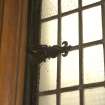 Interior. Detail of catch on window in W aisle