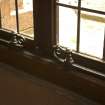 Interior. Corridor to N of cloister, detail of window catches