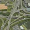 Oblique aerial view centred on the motorway interchange, taken from the WNW.