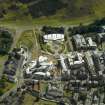 Oblique aerial view centred on the Scottish Parliament with the exhibition centre adjacent, taken from the NNW.