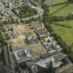 Oblique aerial view of the hospital during redevelopment with the dental institute adjacent, taken from the WNW.