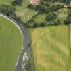 Oblique aerial view centred on the cropmarks of the fort and possible causewayed enclosure, taken from the SE.