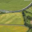 Oblique aerial view centred on the cropmarks of the fort and possible causewayed enclosure, taken from the NE.