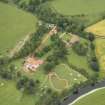 Oblique aerial view centred on the house, taken from the SSW.