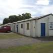 View.  Former station armoury hut in Technical area from SW.