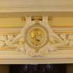 Interior. 1st floor, corridor, view of pediment with roundel (Scott)