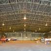 Interior.  Bellman type aircraft hangar showing metal roof trusses.