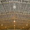 Interior.  Bellman type aircraft hangar. Detail of metal roof trusses.