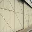 View.  Bellman type aircraft hangar.  Detail of doors from W.