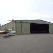 View. Bellman type aircraft hangar, view from NE with doors open.