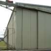 View.  Bellman type aircraft hangar.  Detail of door gantry and air-raid siren.