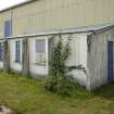 View.  Bellman type aircraft hangar.  Detail of side office hut on E side.