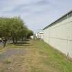 View.  Bellman type aircraft hangar from SW of W wall.