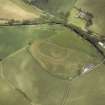 Oblique aerial view centred on the remains of the motte and bailey castle, taken from the SW.