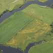 Oblique aerial view centred on the cropmarks of the settlement with the bridge adjacent, taken from the S.