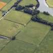Oblique aerial view centred on the parchmarks of the Roman Temporary Camp, taken from the NNE.
