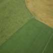 Oblique aerial view centred on the cropmarks of the enclosure, taken from the NE.