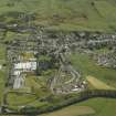 Oblique aerial view of the housing and part of the town, taken from the SW.