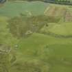 Oblique aerial view centred on the remains of the farmstead and the SW rampart of the Roman Fort, taken from the ESE.