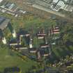 Oblique aerial view centred on the training centre, flats and housing, taken from the SSW.