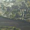 Oblique aerial view centred on the basin and the site of the ship yard with the bridge adjacent, taken from the NNE.