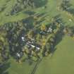 Oblique aerial view of the country house and farmsteading, taken from the SE.