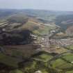 General oblique aerial view centred on the town with the road bridge in the foreground, taken from the SE.