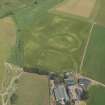 Oblique aerial view centred on the cropmarks of the settlement and the possible motte and bailey, taken from the SSW.