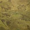 Oblique aerial view centred on the remains of the sheepfolds and field systems, taken from the NW.