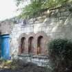 View of potting shed with brick arched detail in ashlar SSW facing wall