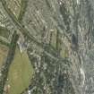 General oblique aerial view of the city centred on the course of the canal and the sports field, taken from the S.