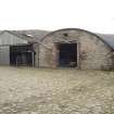 Pitched and arched roof byres to S of steading, view from E