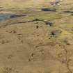 Oblique aerial view centred on the remains of the coal mines and bell pits, taken from the SE.