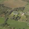 Oblique aerial view centred on the country house, garden and stables, taken from the ESE.