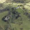 General oblique aerial view centred on the country house, stables and glasshouse, taken from the WSW.