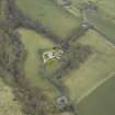 Oblique aerial view centred on the country house with stables, gate-lodge, gate piers and gates adjacent, taken from the WNW.