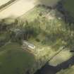 General oblique aerial view centred on the country house, stables and gardens with the house adjacent, taken from the S.
