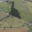 Oblique aerial view centred on the gates with the caravan site, road bridge and stable adjacent, taken from the ESE.