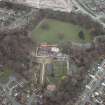 Oblique aerial view centred on the house and walled garden with the gate lodge adjacent, taken from the S.