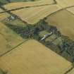 Oblique aerial view centred on the country house, greenhouse, walled garden, granary and farmsteading, taken from the SW.
