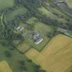 Oblique aerial view centred on the country house, formal garden and stables, taken from the SW.