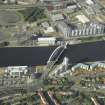 Oblique aerial view centred on the construction of the bridge, taken from the SSW.