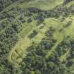 Oblique aerial view centred on the remains of the Roman fort and the course of the Antonine Wall, taken from the NE.