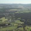 General oblique aerial view looking over Nethy Bridge towards the Grampian Highlands, taken from the NW.