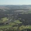 General oblique aerial view looking over Nethy Bridge towards the Grampian Highlands, taken from the W.