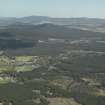 General oblique aerial view looking over Nethy Bridge towards the Hills of Cromdale, taken from the W.