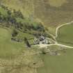 Oblique aerial view centred on the farmhouse with the farmsteading adjacent, taken from the NE.